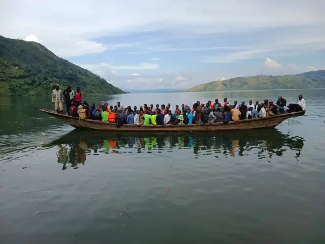 People move in canoe after floods and landslides in the eastern Democratic Republic of Congo on May 08, 2023.