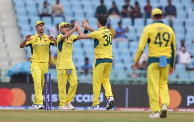 Pat Cummins celebrates the wicket of Kusal Perera