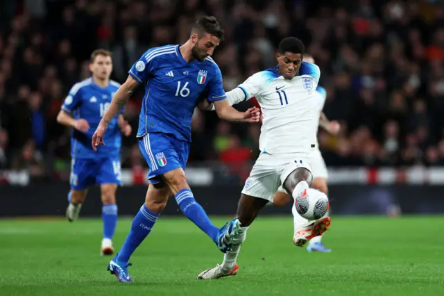 Rashford tries to run beyond Cristante.