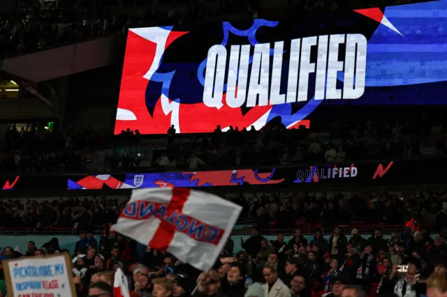 The Wembley scorebaord shows England's qualification.