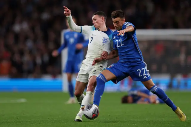 Foden tries to run the ball past El Sharaawy.