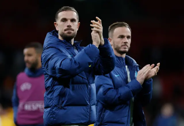 Henderson walks around the Wembley pitch clapping fans at full time.