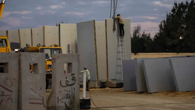 Workers seen at Rafah border gate on October 17, 2023