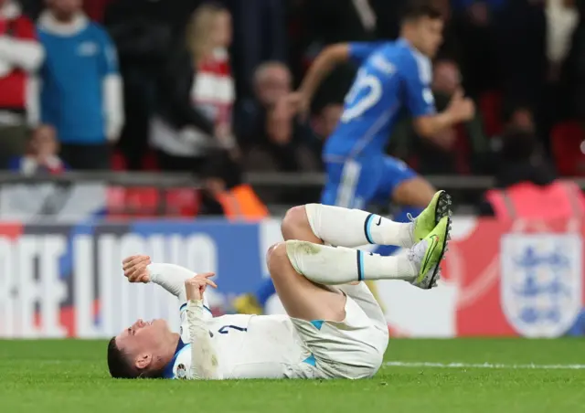 Foden lies on the floor after being flattened.