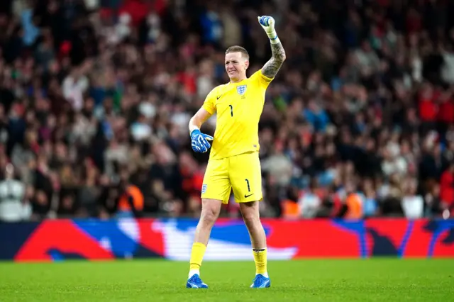 Pickford fist pumps in celebration.