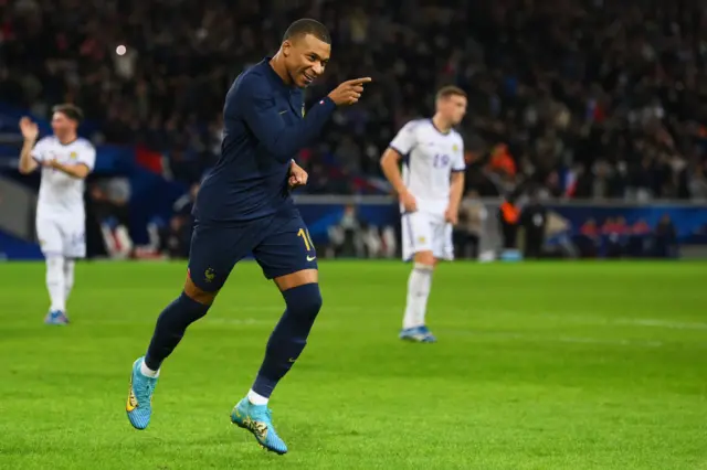 Kylian Mbappé celebrates his penalty goal