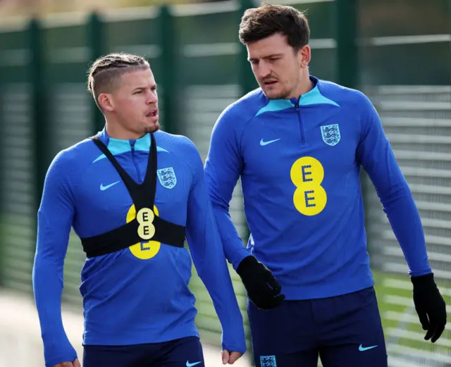 Phillips and Maguire walk out towards the training pitch for England.