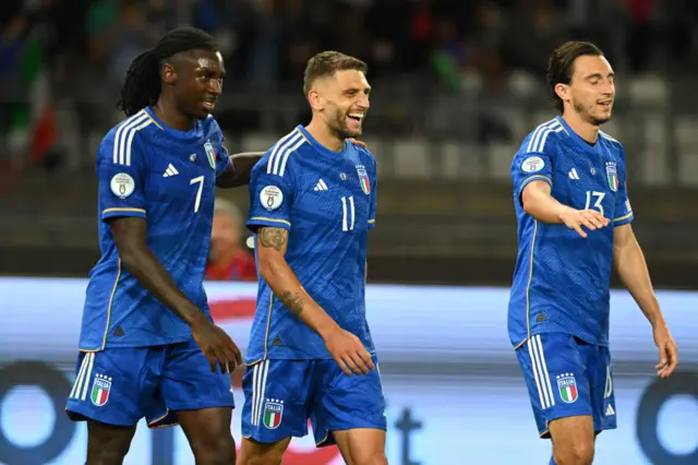 Kean, Berardi and Darmian celebrate Italy's goal v Malta.