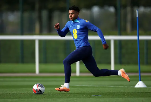 Ollie Watkins runs to control the ball in England training.