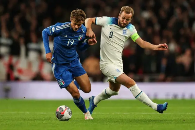 Kane tries to win the ball back in midfield.