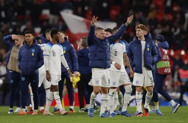 Phillips raises his hands as the crowd sing 'Sweet Caroline'