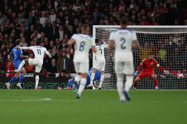 Rashford scores the second England goal.