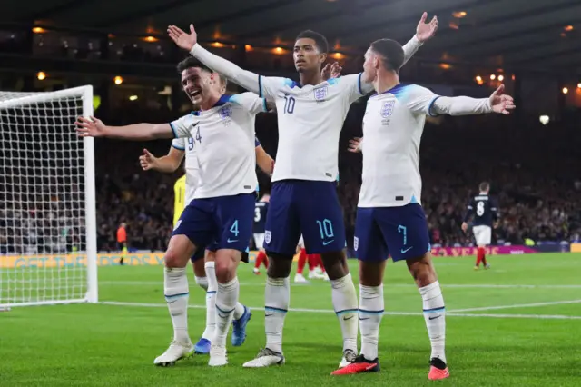 Foden and Rice join Bellingham in celebrating his goal v Scotland.