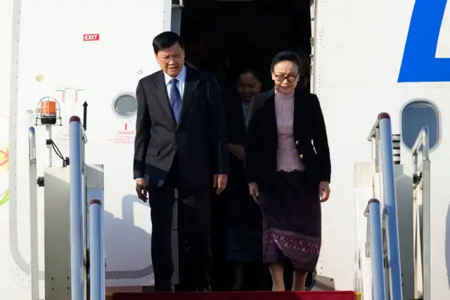 Laos Prime Minister Thongloun Sisoulith is accompanied by his wife Naly Sisoulith