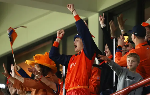 The Netherlands fans celebrate a six