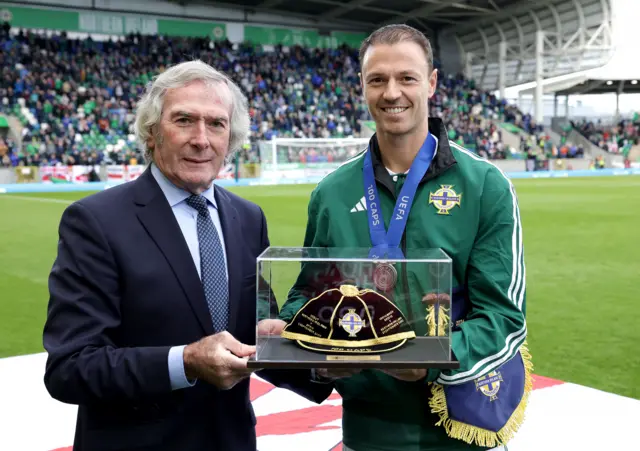 NI Legend Pat Jennings presents Jonny Evans with his 100th International Cap