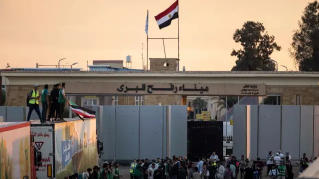 Volunteers and NGOs stuff are seen at Rafah border