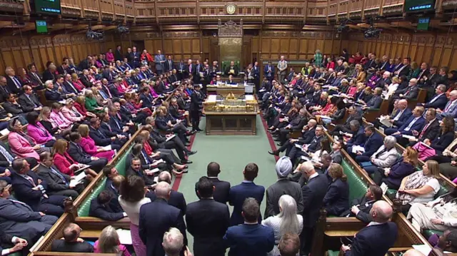 Rishi Sunak stands in the House of Commons