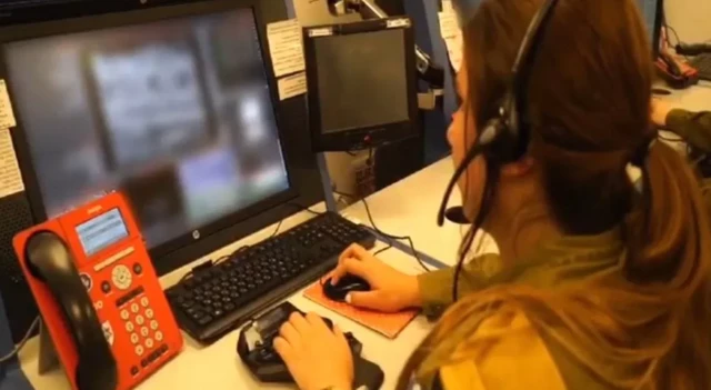 "War room" staff working at a computer