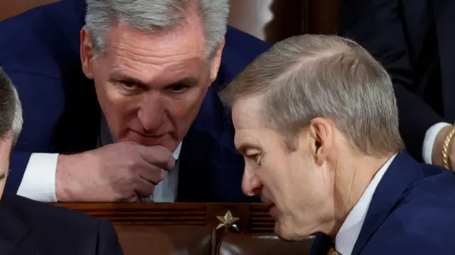 Former Speaker of the House Rep. Kevin McCarthy confers with U.S. Rep. Jim Jordan, the top contender in the race to be the next Speaker of the U.S. House of Representatives