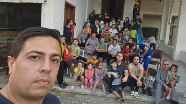 People pictured outside Ibrahim AlAAgha's parents' house