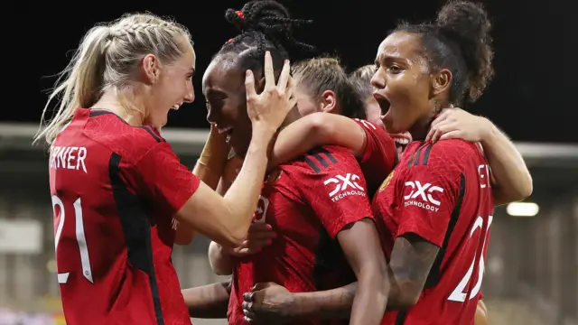 Manchester United's players celebrate a goal