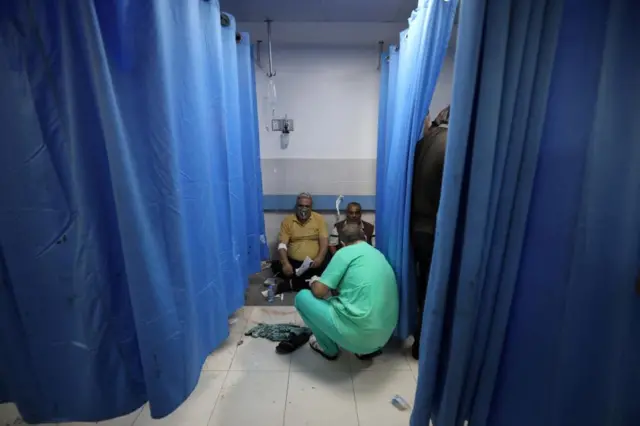 Doctors are attending to the wounded on the ground and along corridors