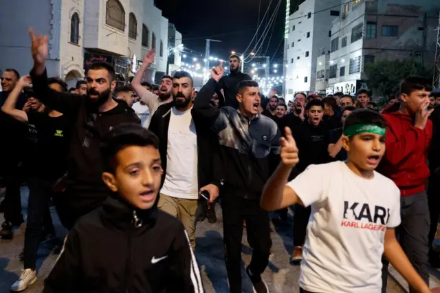 Protesters marching across Tubas, a city in the occupied West Bank, following the hospital attack