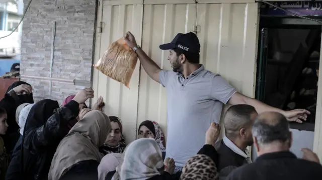 People queuing for bread at a bakery in Khan Younis, southern Gaza