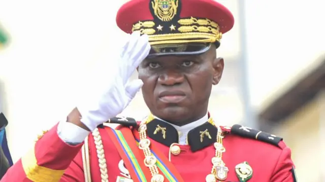 The leader of Gabon's military junta General Brice Oligui Nguema (C) reviews the troops after being sworn in as interim president in Libreville, Gabon, 04 September 2023