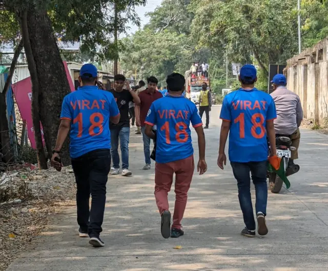 Three India fans wearing Kohli shirts