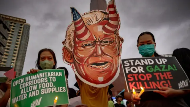 In the Philippines, protesters held up a depiction of Joe Biden as the devil