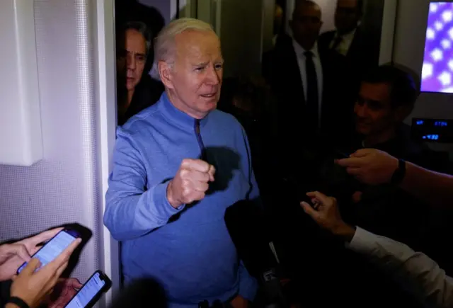 US President Joe Biden speaks to reporters onboard Air Force One