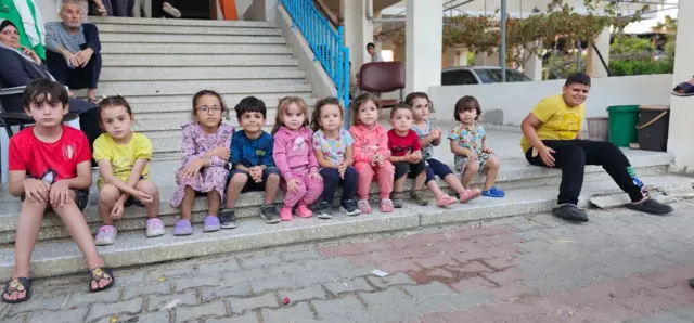 Children pictured outside the family home of Ibrahim AlAgha