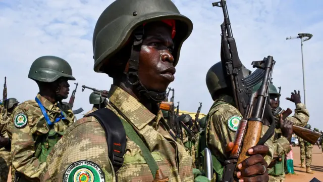 Members of South Sudan People's Defence Forces (SSPDF), part of the troops of the East Africa Community Regional Force (EACRF), gather before departing on their deployment as part of a regional military operation targeting rebels, at the Juba International Airport in Juba, South Sudan - 3 April 2023