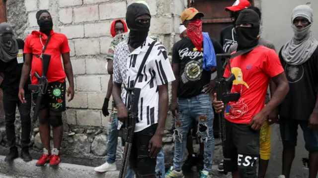 Former police officer Jimmy "Barbecue" Cherizier (not pictured), leader of the 'G9' coalition, is accompanied by Security during a march against Haiti's Prime Minister Ariel Henry, in Port-au-Prince, Haiti September 19, 2023.