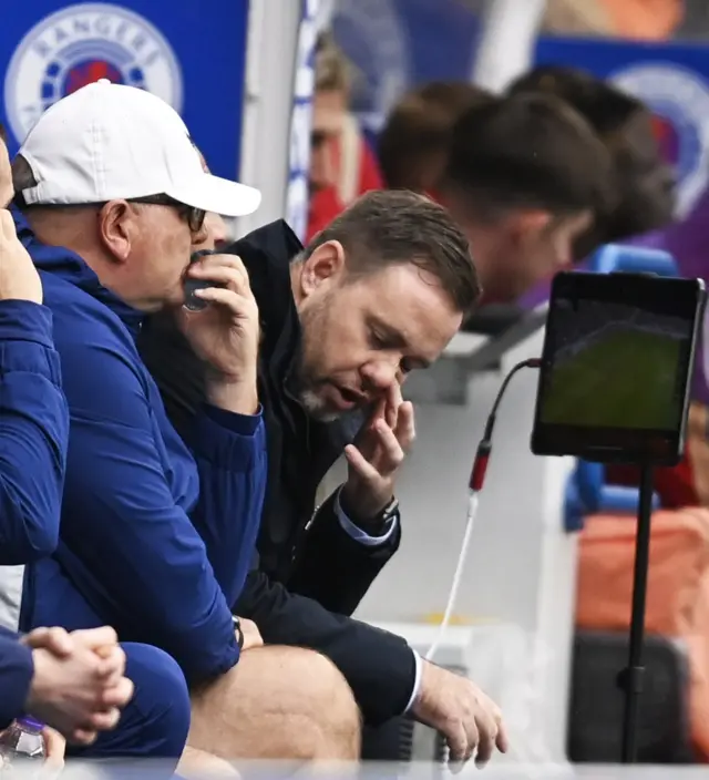 Michael Beale looks distraught in Rangers' dugout