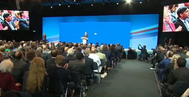 Audience claps for Jeremy Hunt on stage