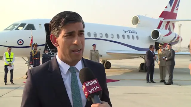 Rishi Suna speaking on the tarmac