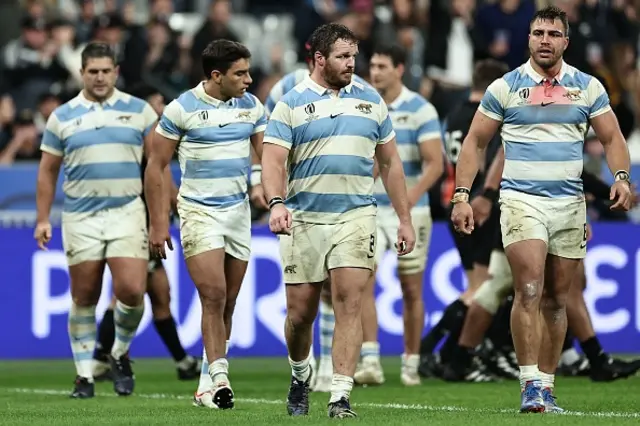 Julian Montoya and team-mates look dejected after the game