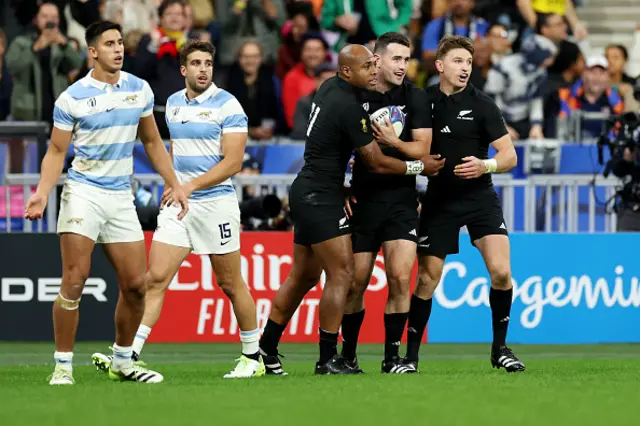 Will Jordan of New Zealand celebrates with Mark Telea and Beauden Barrett