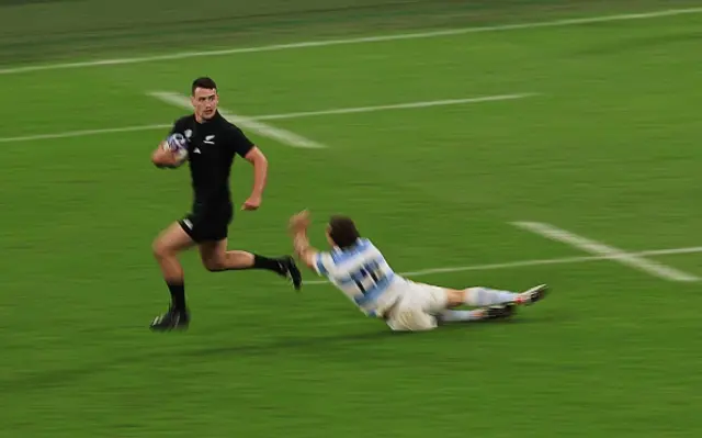 New Zealand's right wing Will Jordan runs on his way to scoring a try