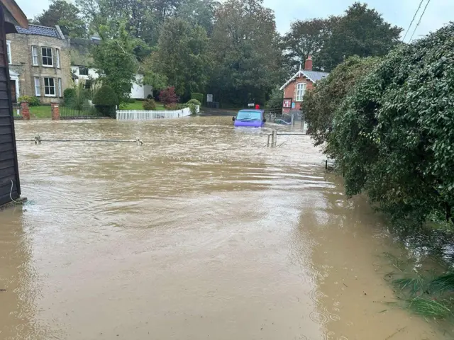 Van stuck in floodwater in Earl Soham