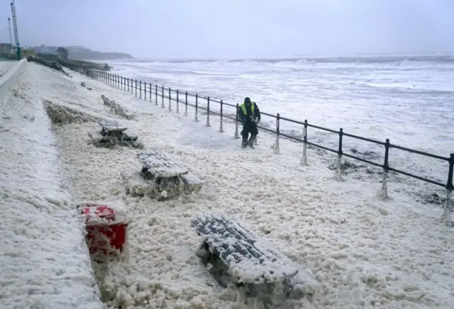 Sea foam covers the path in Seaburn, Sunderland