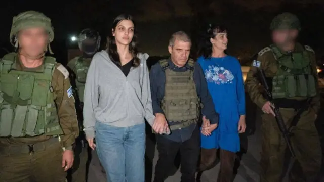 Judith and Natalie Raanan walk at night after being freed by Hamas