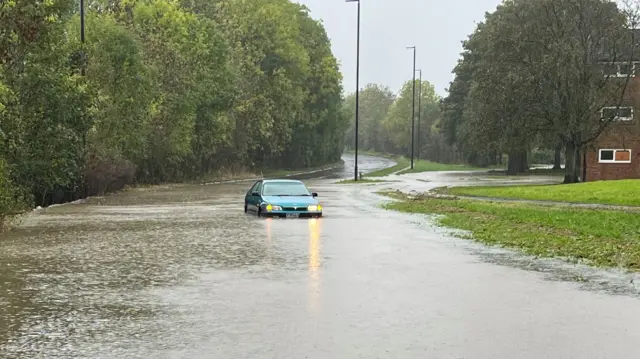 A car stuck in flood water on the Jordanthorpe Parkway