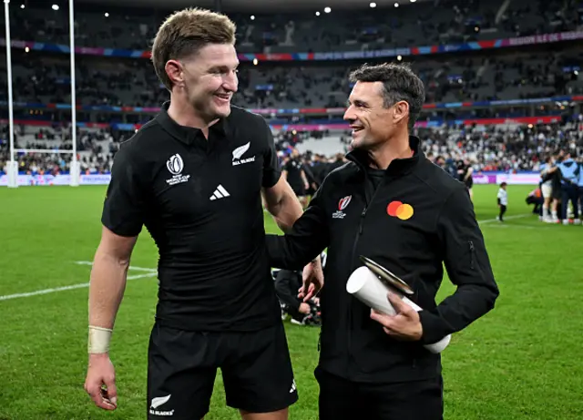 Jordie Barrett of New Zealand, is presented with a Trophy by Dan Carter