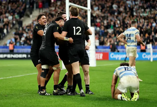 Will Jordan of New Zealand celebrates with teammates