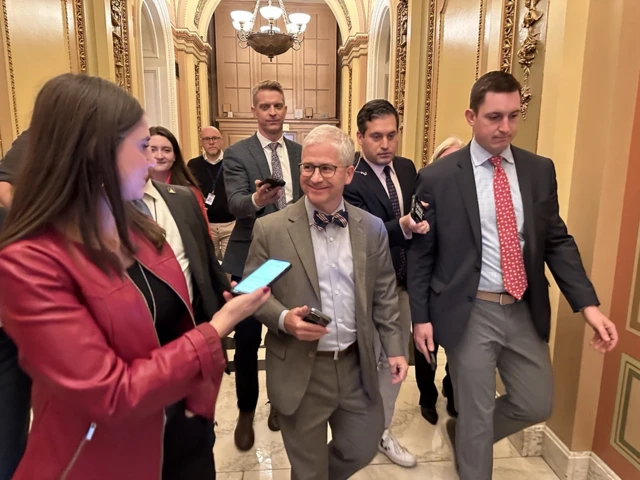 North Carolina House Rep Patrick McHenry walks through Congress