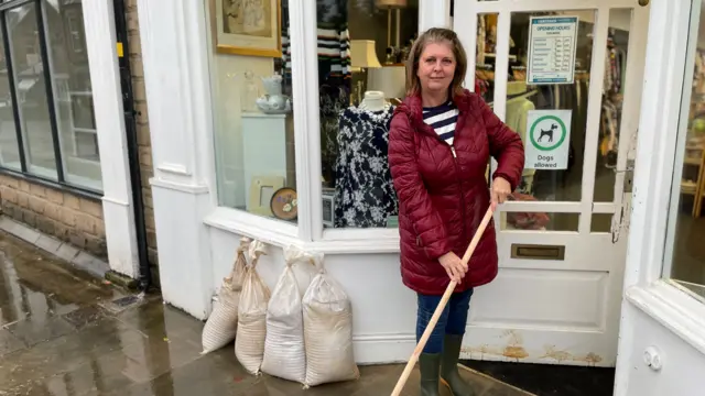 Michelle Hardwick outside the shop